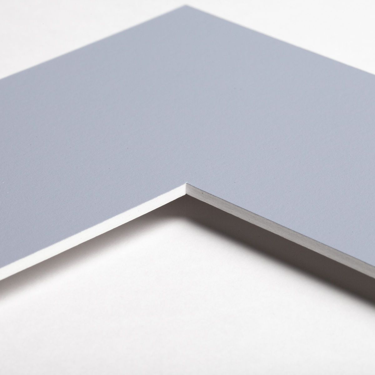 Découvre un aperçu détaillé du coin de ton passe-partout de qualité supérieure chez MonCadrePréféré, disponible en bleu ciel.