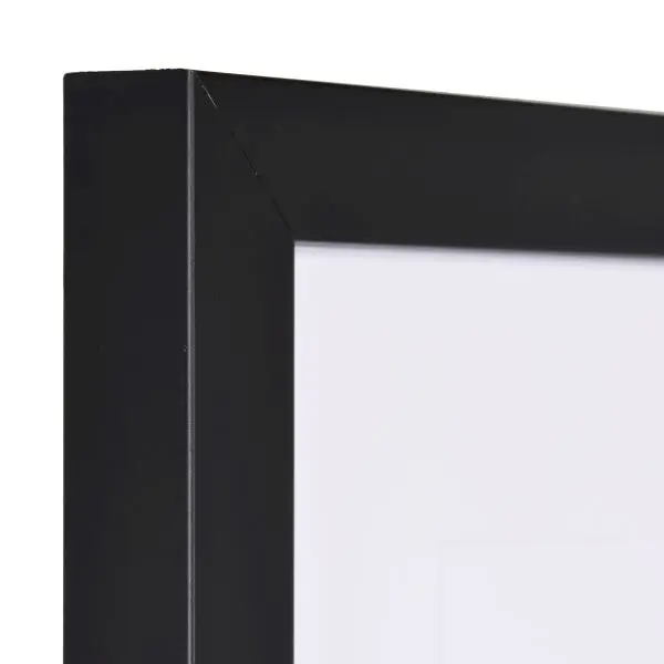 Vue de l'angle d'un cadre photo en bois noir avec une surface lisse et un profil cubique. Idéal pour toi chez MonCadrePréféré.